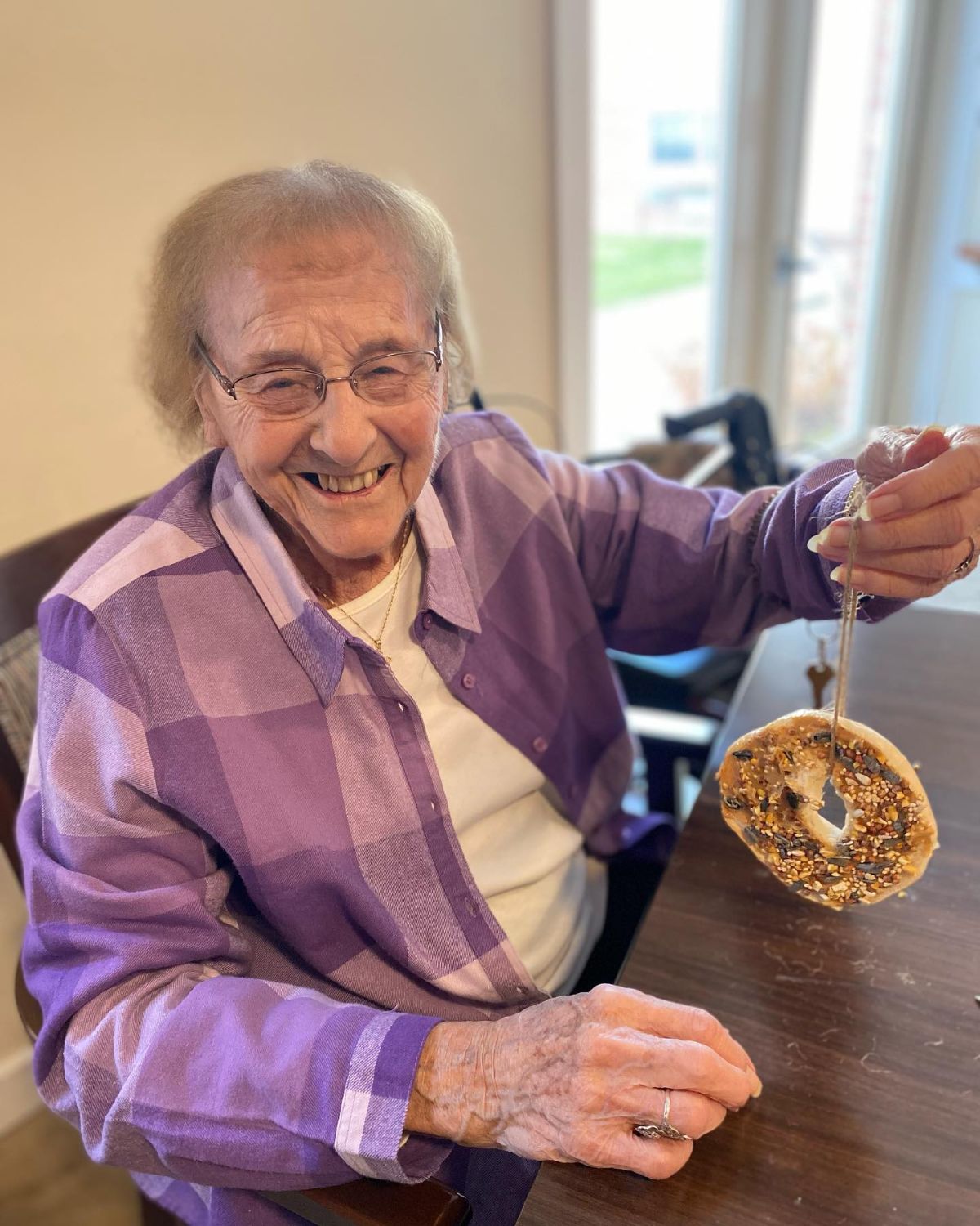Resident creating a treat for birds at Carriage Court Senior Living in Hilliard, OH